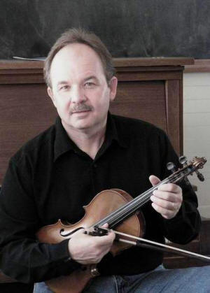 Violinist Tim Crouch is also a virtuoso guitar and mandolin player.