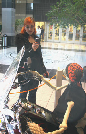 ASU student Jordan Holmes photographs the iconic Harley-riding skeleton who has become emblematic of the ASU Museum's Dia de los Muertos celebration.