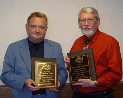 Dr. Larry Dale and Professor Richard Jorgensen hold the plaques presented to them upon retirement from ASU. Dr. Whitney Williams and Dr. William Wyatt were not present.