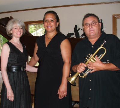 The Ozark Jazz Orchestra (from left) includes pianist Joy Sanford,vocalist Lisa Ahia, and trumpeter Gary Gazaway; violinist Tim Crouch is pictured separately.