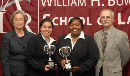 Judge Susan Webber-Wright, Lilia Pacheco, Jervonne Newsome, and Bowen School of Law's Dean John DiPippa pose after the South Central Regional Moot Court Championship Tournament.
