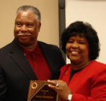 Alumnus Marlon Henderson receives Outstanding Alumni Award from Ruby Henderson of Jonesboro. Photo courtesy Dr. Nancy Hendricks, director, Alumni Communications.