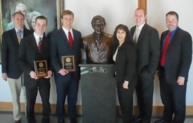 Abram Skarda, second from left, and Daniel Shults, third from left, pose with their plaques after finishing the ASU Moot Court season with wins at Baylor School of Law.