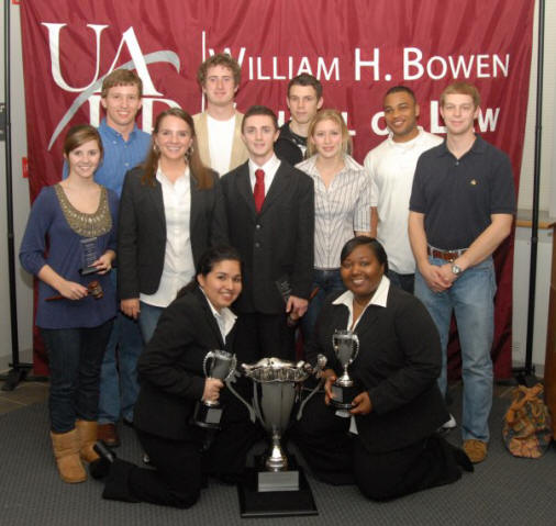 The ASU Moot Court team poses with the Robert R. Wright III championship trophy they won at the South Central Regional Moot Court Championship Tournament.