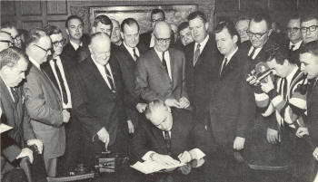 Gov. Rockefeller signs bill elevating ASC to ASU, Jan. 17, 1967