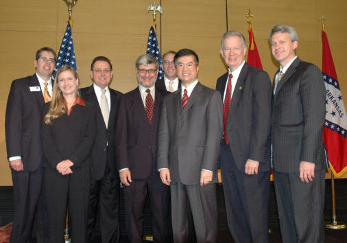 From left, Mark Young, Dr. Carole Cramer, Harold Perrin, Dr. David Radin, Alan McVey, Secretary of Commerce Gary Locke, Dr. Robert L. Potts, and Dr. Len Frey gather at the presentation ceremony of $1.75 million to the Arkansas Biosciences Institute.
