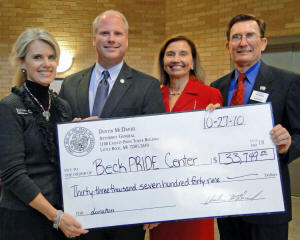 (From left) Director of Beck PRIDE Center for America's Wounded Veterans Susan Tonymon; Arkansas Attorney General Dustin McDaniel; Dean of the College of Nursing and Health Professions Dr. Susan Hanrahan; Col. (Ret.) Jerry Bowen, founding member of the Beck PRIDE Center National Advisory Council.