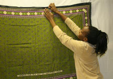 Rose Ong'oa works on the exhibit "Wearing What Cannot Be Spoken," opening at the ASU Museum on Friday, Feb. 1.