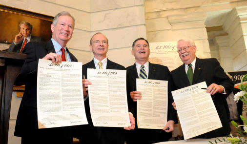 ASU Chancellor Dr. Robert L. Potts, SAU President Dr. David F. Rankin, ATU President Dr. Robert C. Brown, and UAM Chancellor Dr. H. Jack Lassiter display their ceremonial copies of Act 100, signed by Arkansas Governor Mike Beebe. Photo courtesy of Kirk Jordan, Arkansas Governor's Office.