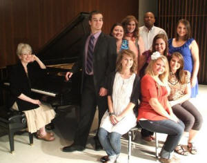 Seated at the piano: Joy Sanford, accompanist for ASU Opera Theatre;back row: Kale McDaniel, Crystal Aronson, Katherine Richards, Craig Young, Becky Morrison;leaning over seated women (middle): Renee Smith; seated on chairs in front: Paige Harris, Erin Reagan, Kari Rickman.