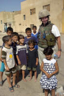 Amy Schlesing surrounded by Iraqi children