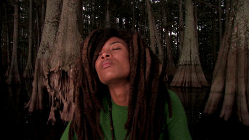 Blueswoman Valerie June emphasizes her musical roots in a cypress swamp. Photo credit: Alan Spearman.