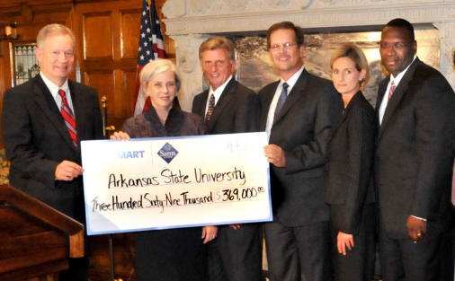 Dr. Robert L. Potts, Dr. Elizabeth Hood, Governor Mike Beebe, Tony Fuller, Laurie Smalling, and Dr. Glen Jones receive a grant check from Wal-Mart.