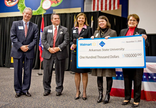 ASU Chancellor Dr. Robert L. Potts, vice chancellor for University Advancement Cristian Murdock, and Dean Susan Hanrahan, College of Nursing and Health Professions, accept a grant check from Wal-Mart representatives.